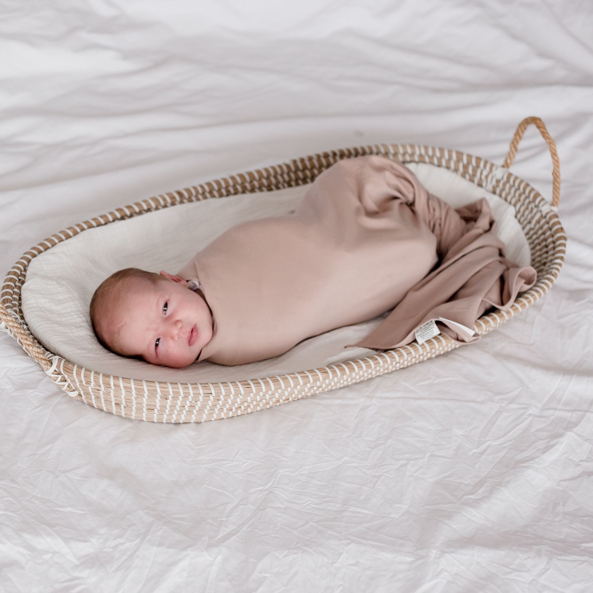 Baby wearing Stretchy Swaddle baby Blanket | Sunset (Organic)