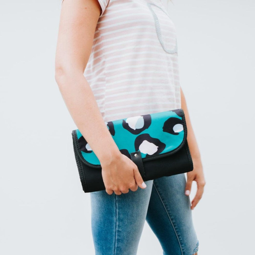 Women showing Nappy Change Mat Clutch | Green Envy